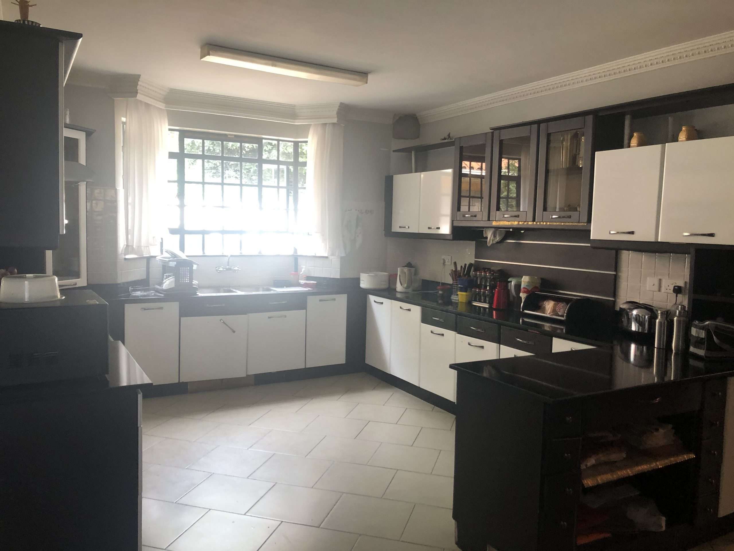 A well-built double storey house with 5 bedrooms, all ensuite set on 0.5 of an Acre of flat land