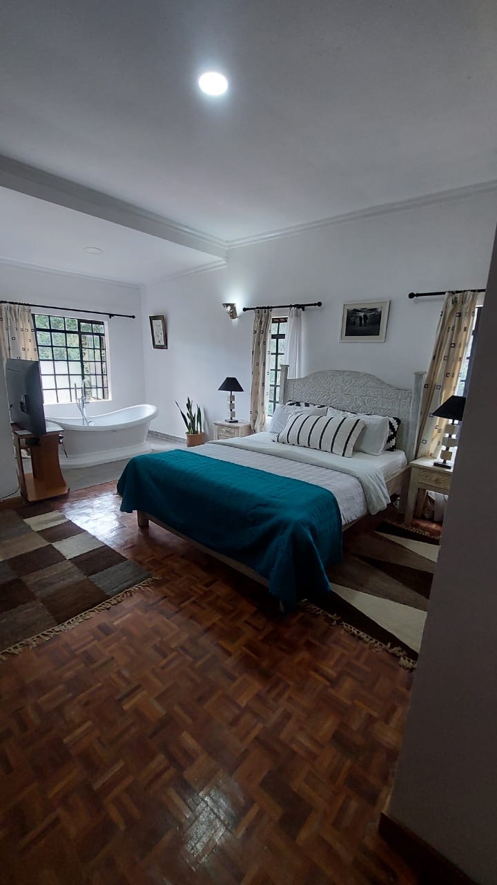 A single story house with a separate guesthouse on 0.37 acres in the private residential area of Mukima, Nanyuki