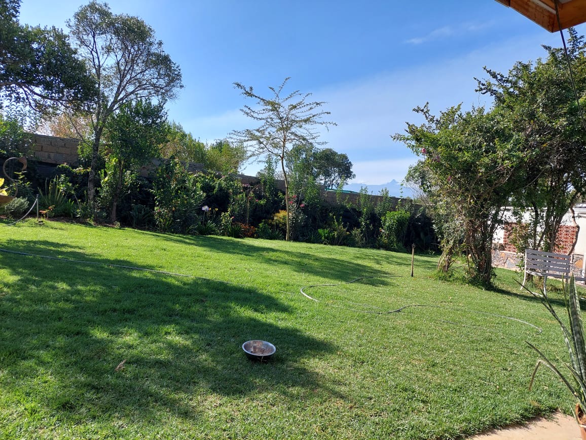 A single story house with a separate guesthouse on 0.37 acres in the private residential area of Mukima, Nanyuki