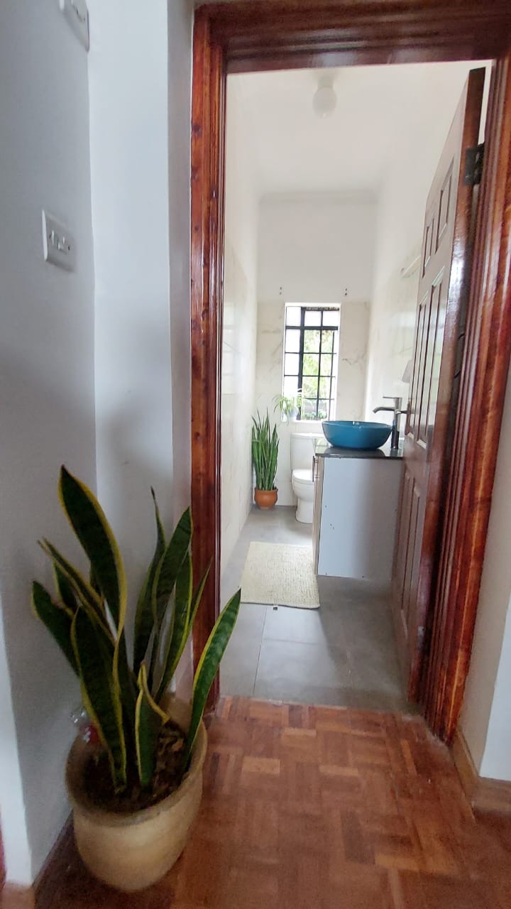 A single story house with a separate guesthouse on 0.37 acres in the private residential area of Mukima, Nanyuki