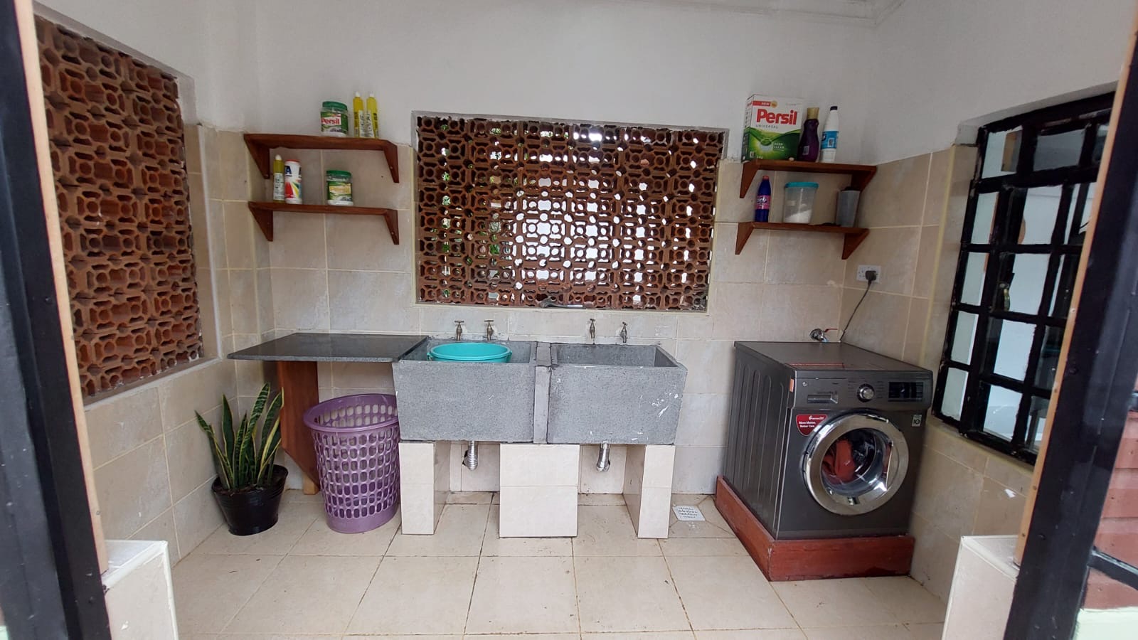 A single story house with a separate guesthouse on 0.37 acres in the private residential area of Mukima, Nanyuki