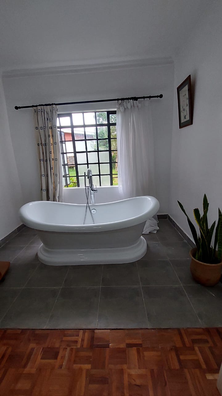 A single story house with a separate guesthouse on 0.37 acres in the private residential area of Mukima, Nanyuki