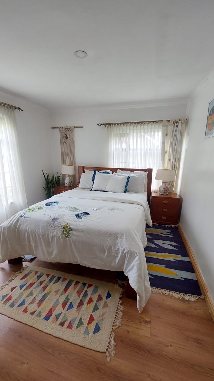 A single story house with a separate guesthouse on 0.37 acres in the private residential area of Mukima, Nanyuki