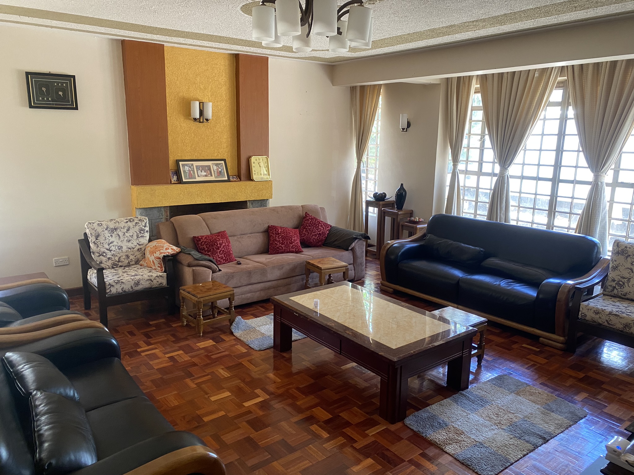 A  five bedroomed double storey residential house with a detached ablution block.