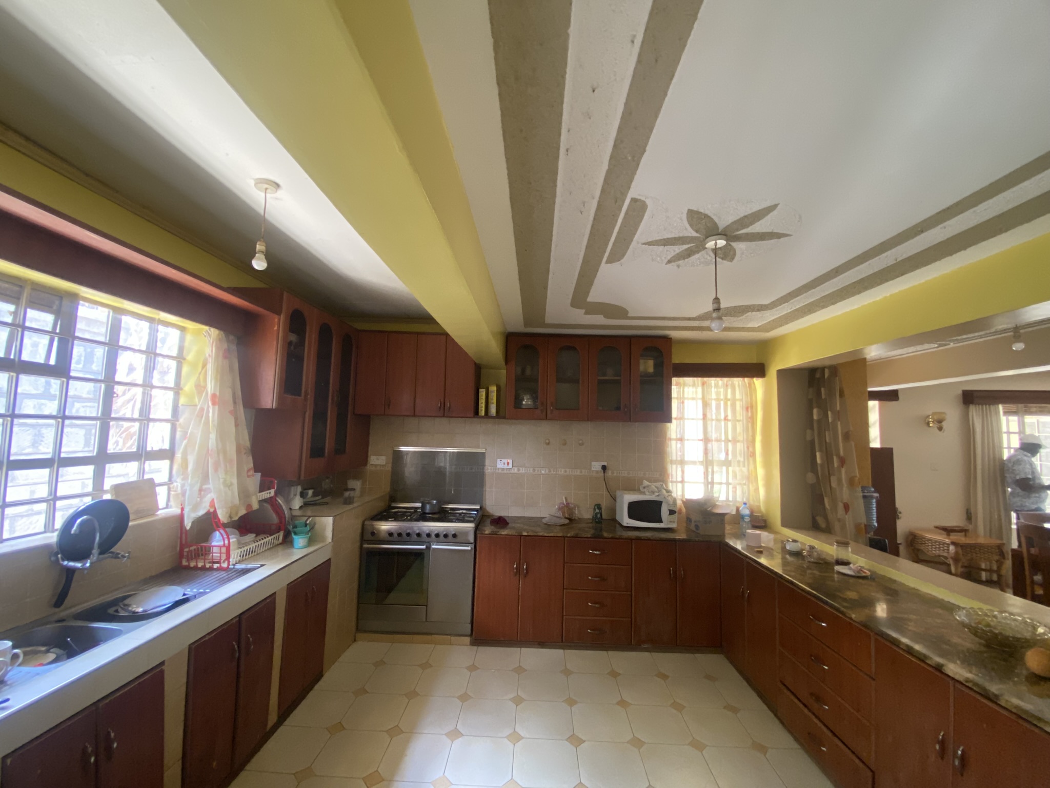 A  five bedroomed double storey residential house with a detached ablution block.