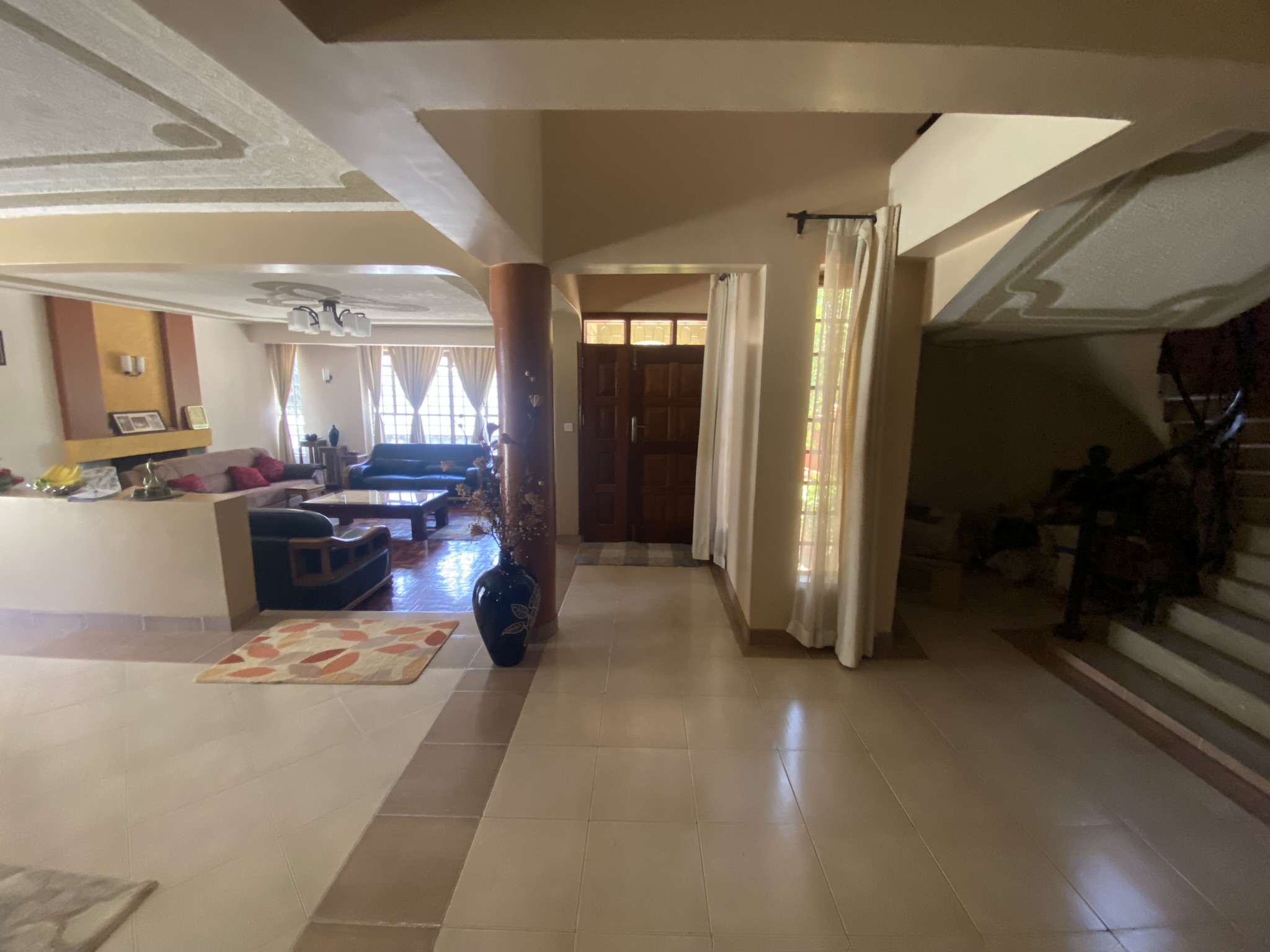 A  five bedroomed double storey residential house with a detached ablution block.