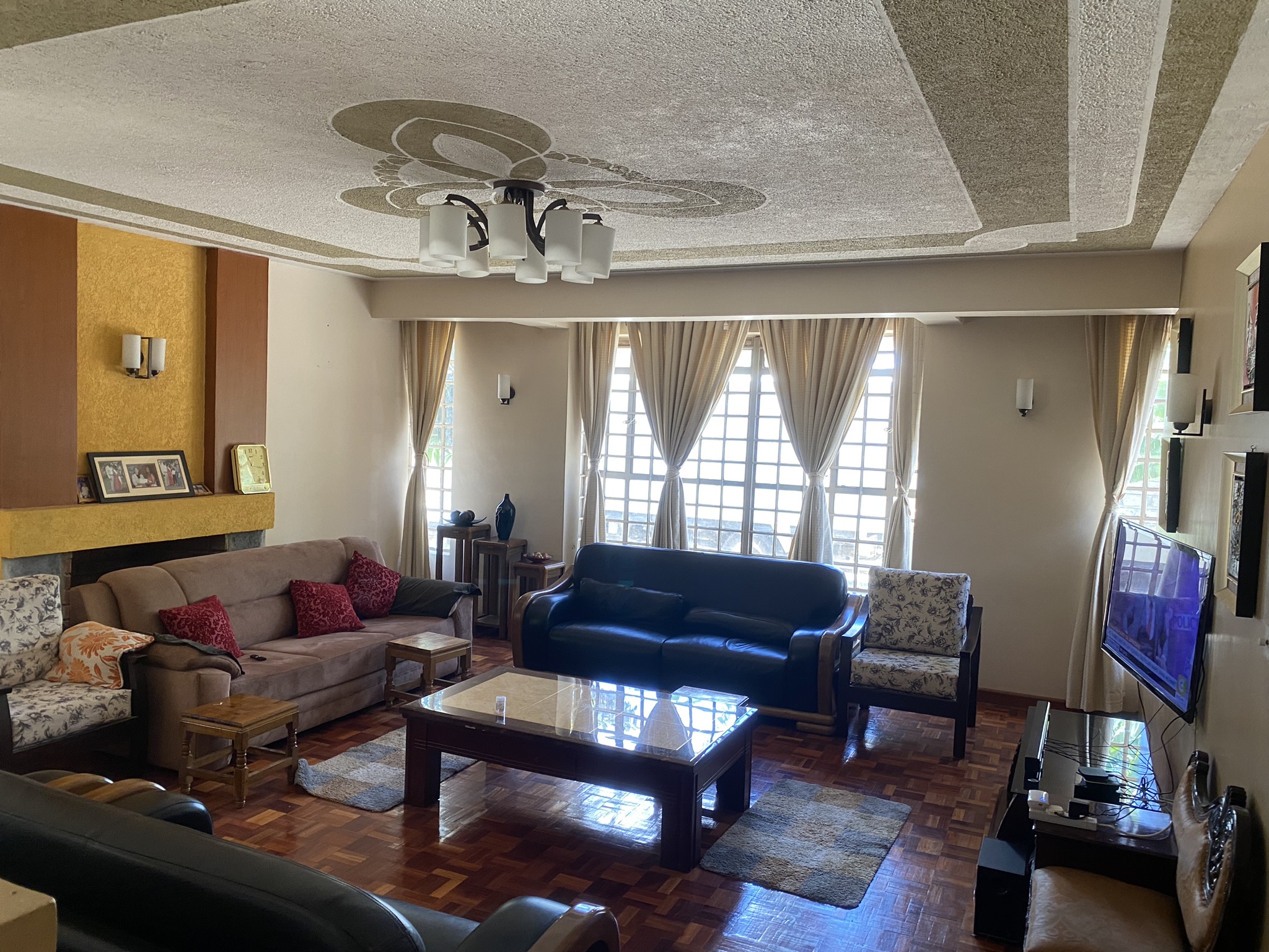A  five bedroomed double storey residential house with a detached ablution block.