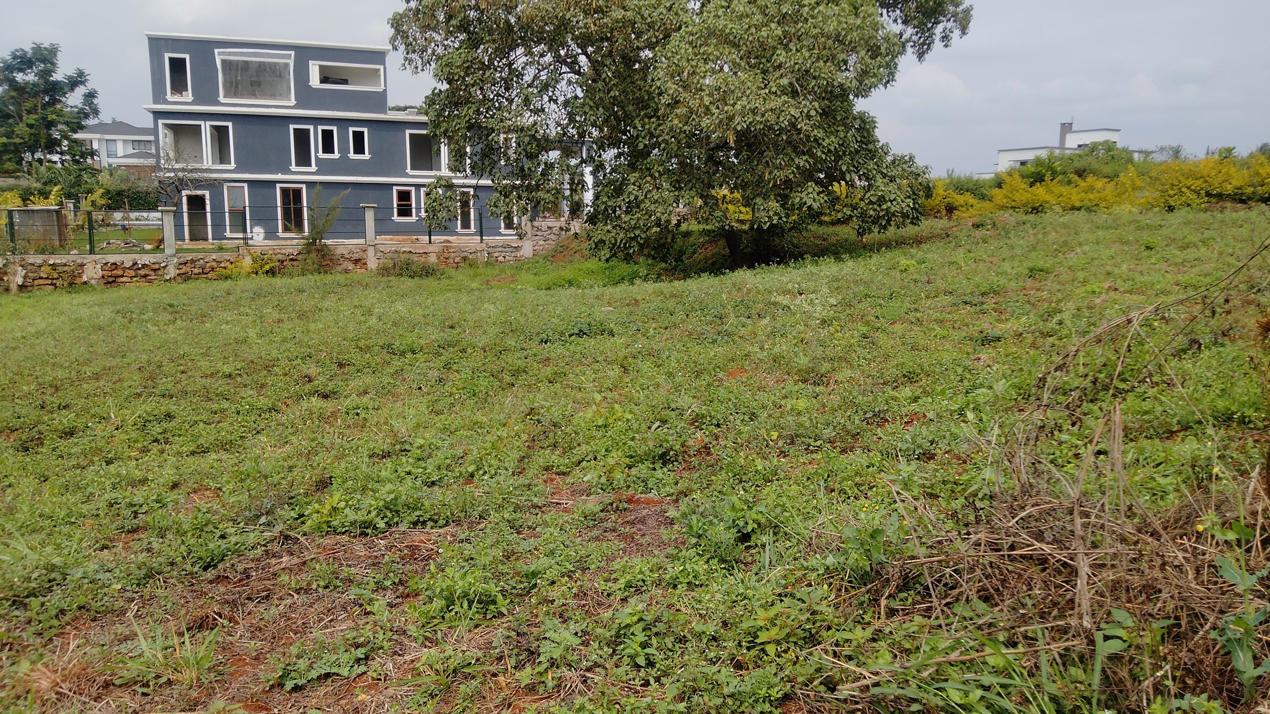 This offering includes 0.5 acres of prime land located within the prestigious Kijani Ridge development