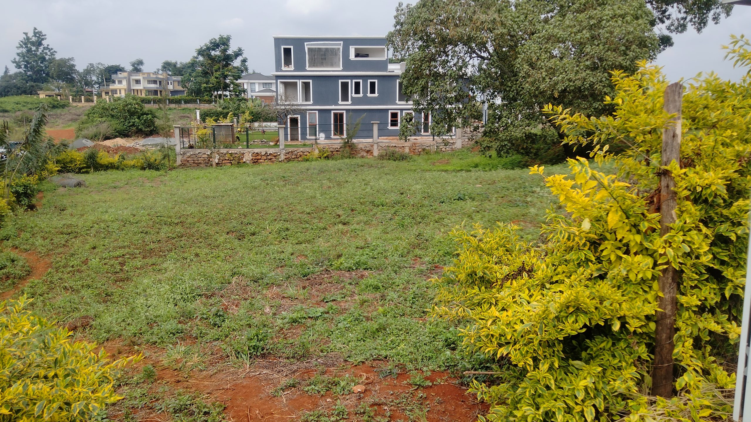 This offering includes 0.5 acres of prime land located within the prestigious Kijani Ridge development
