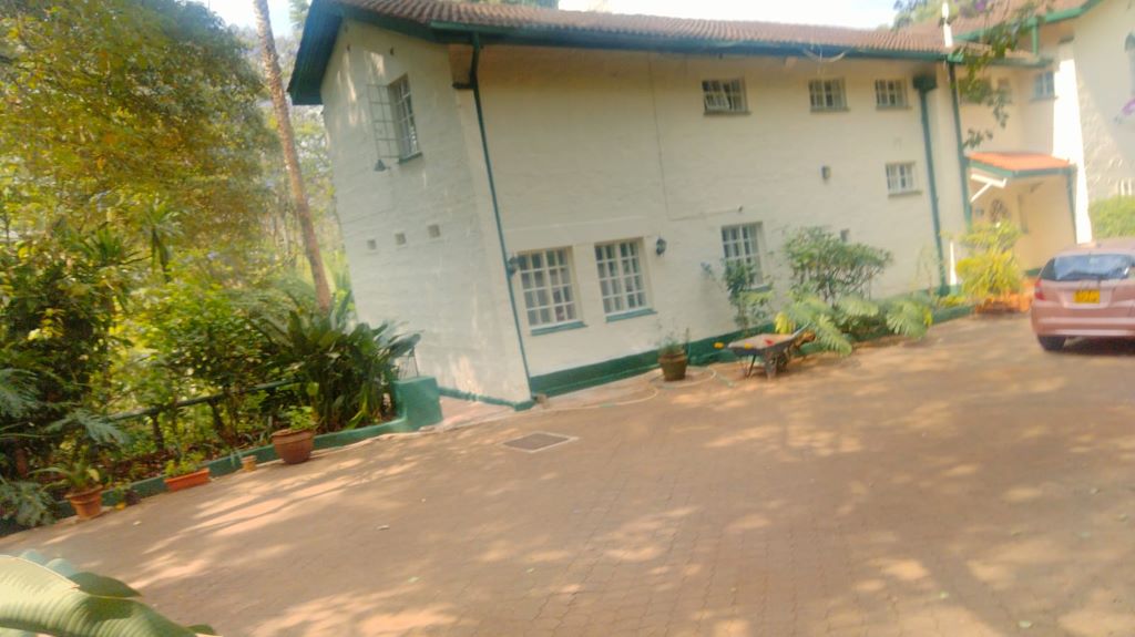 A charming rustic house featuring 4 spacious bedrooms, beautiful views of Karura forest