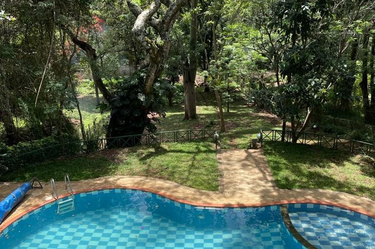 A charming 4-bedroom double storey house on 0.9 Acre of Mature garden for sale          