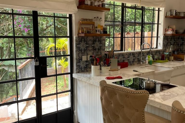 A charming 4-bedroom double storey house on 0.9 Acre of Mature garden for sale          