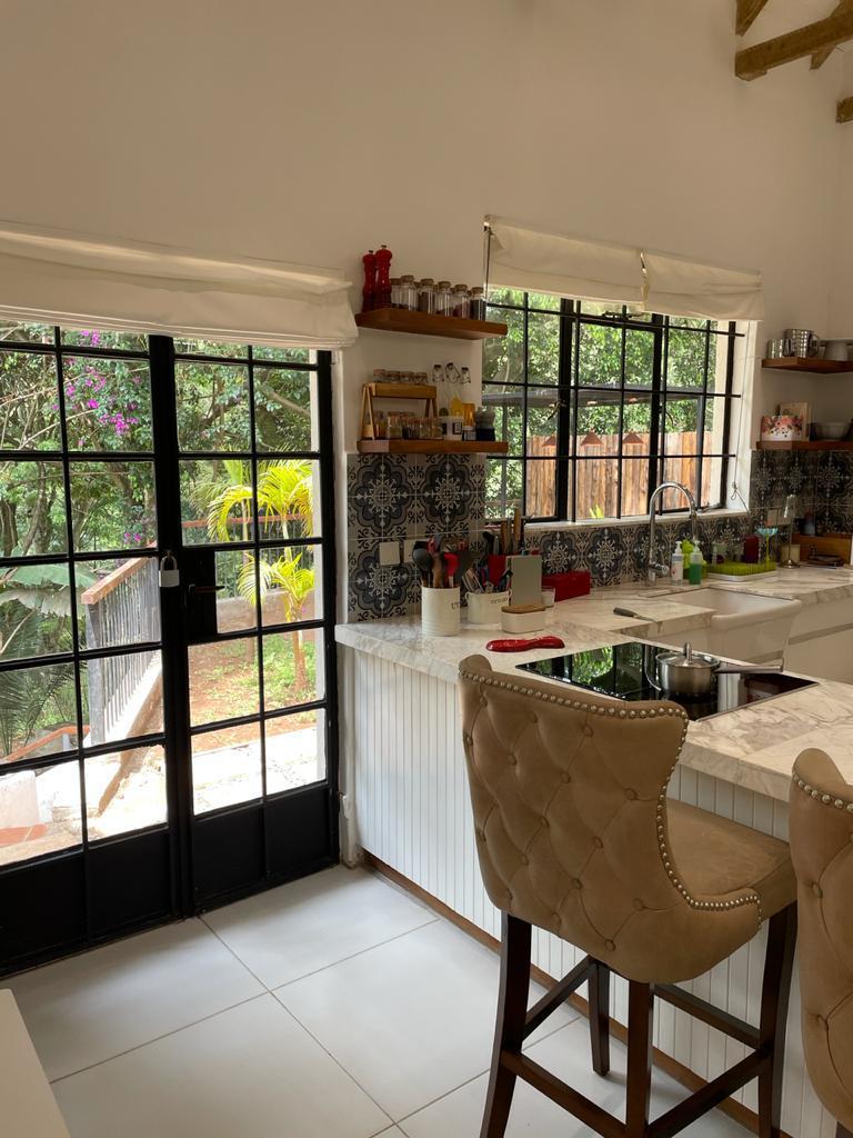 A charming 4-bedroom double storey house on 0.9 Acre of Mature garden for sale          