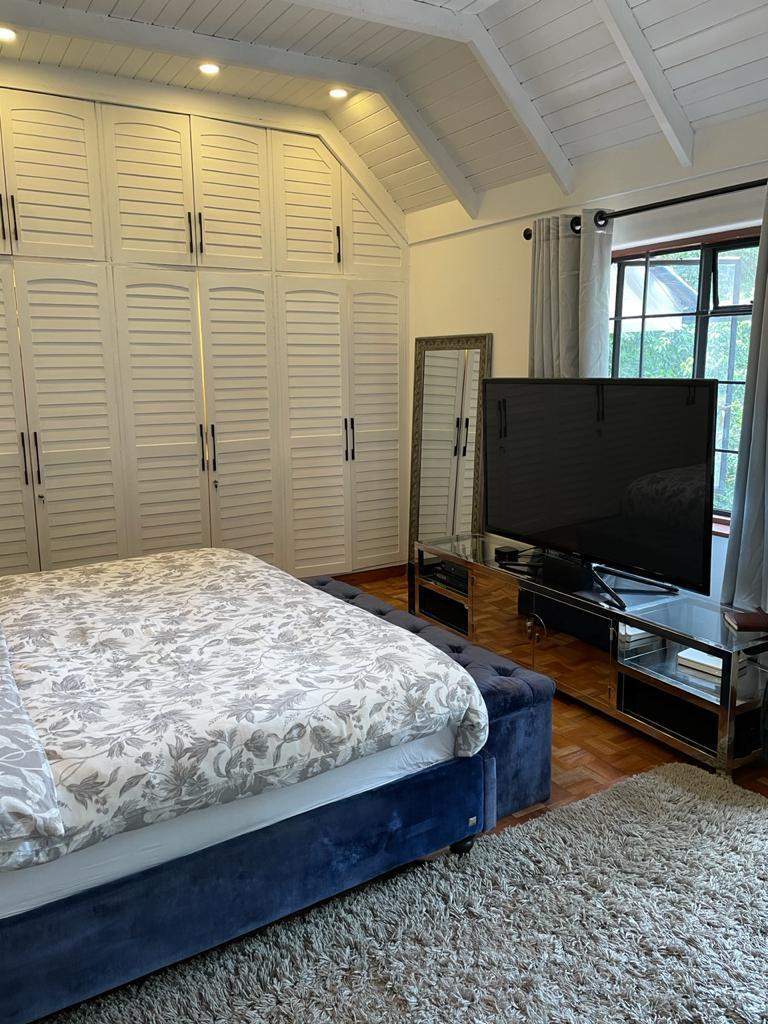 A charming 4-bedroom double storey house on 0.9 Acre of Mature garden for sale          