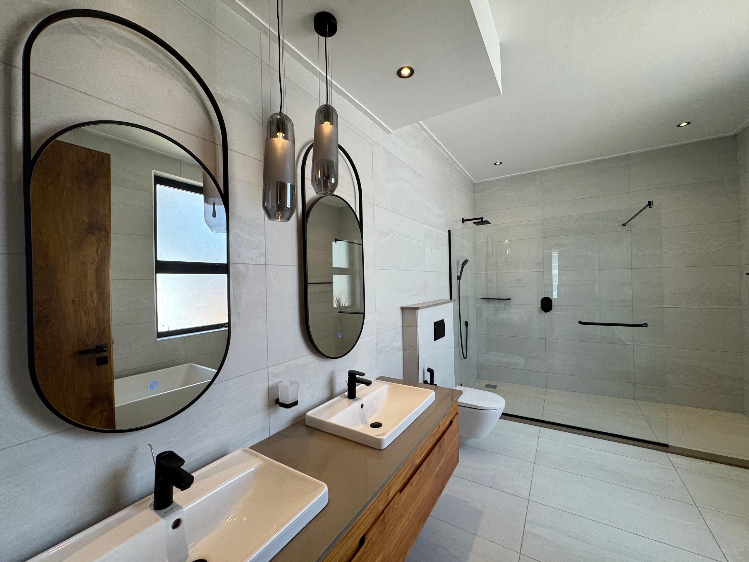A newly built 4-bedroom villa offers contemporary living in a secure, gated compound
