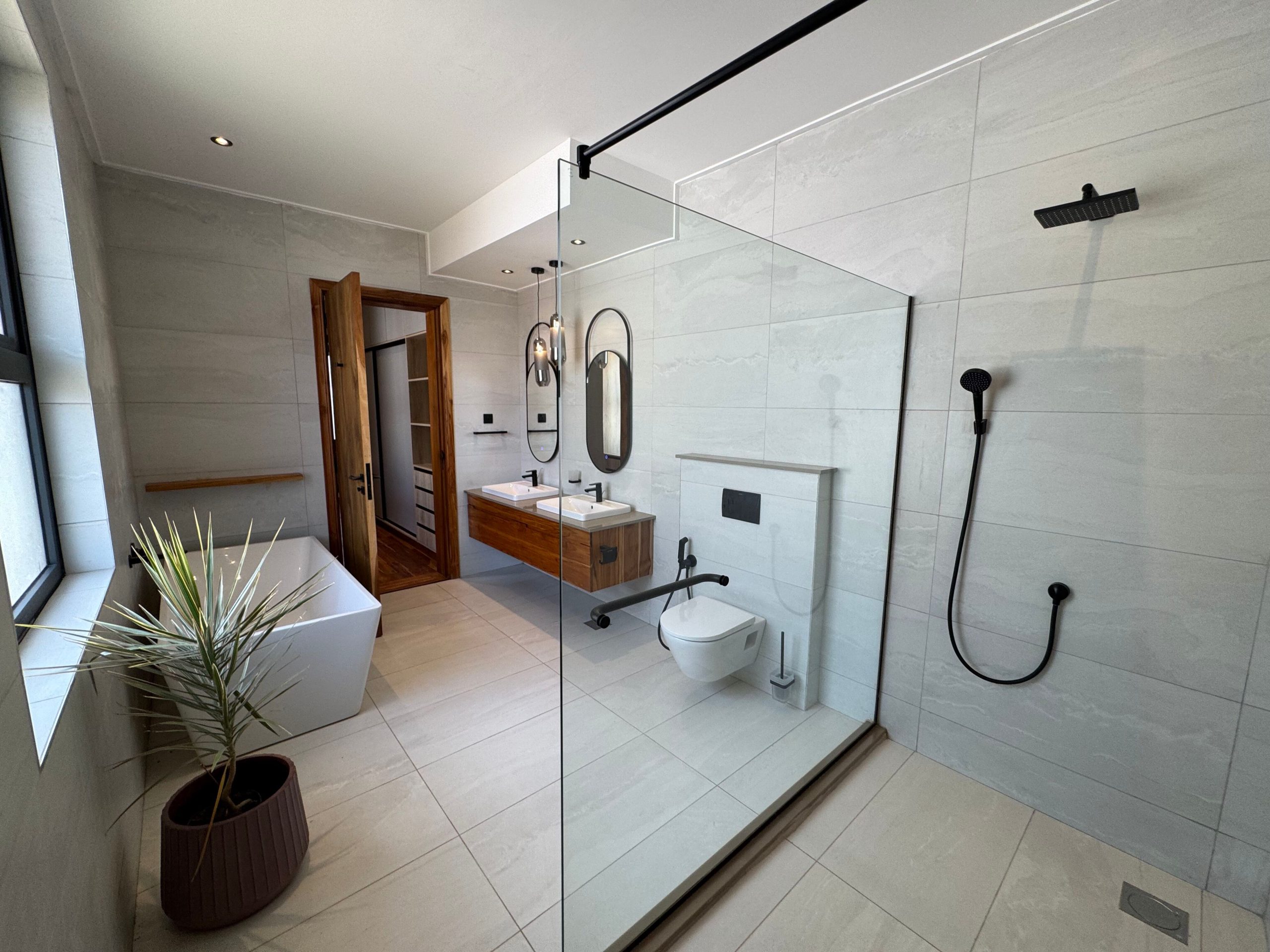A newly built 4-bedroom villa offers contemporary living in a secure, gated compound
