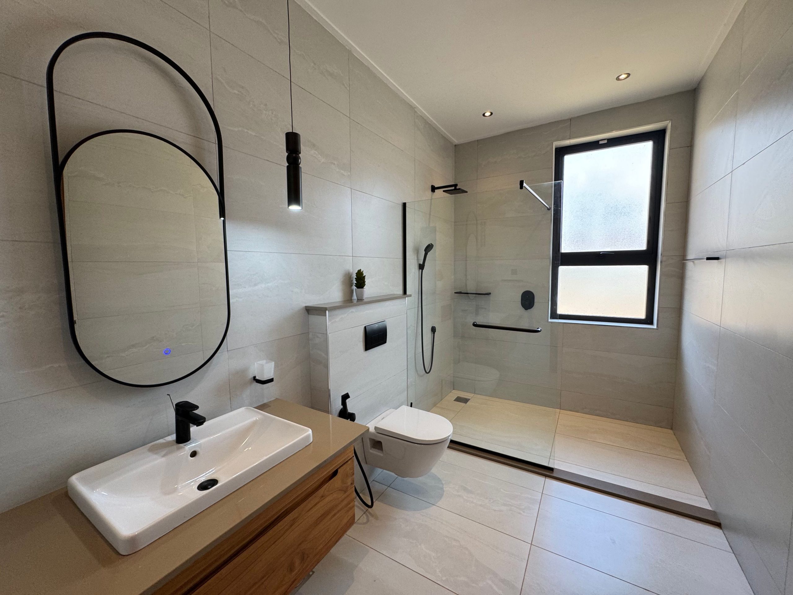 A newly built 4-bedroom villa offers contemporary living in a secure, gated compound