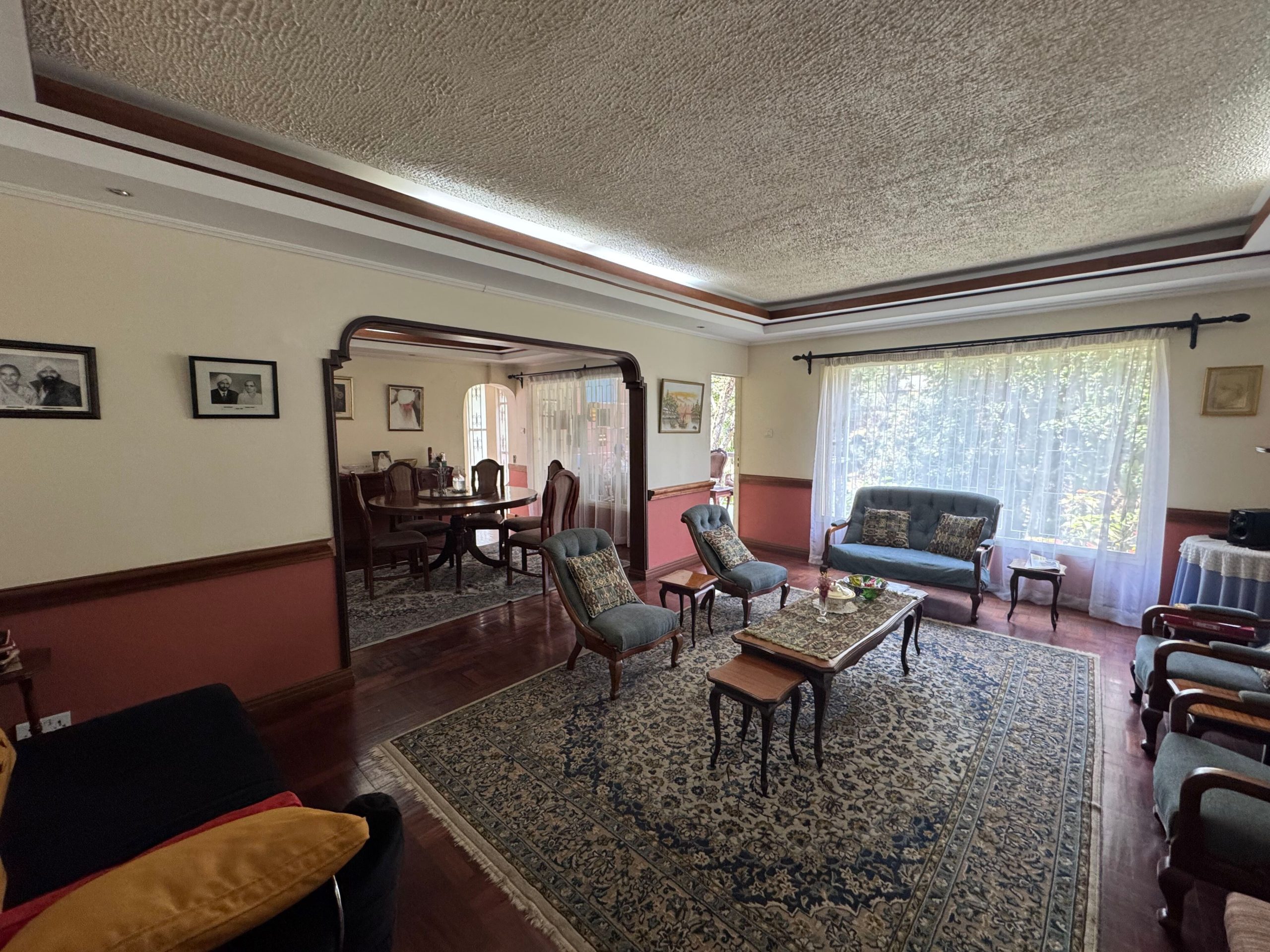 This charming house in Muthaiga exudes character and sits on an expansive, mature garden filled with lush greenery.