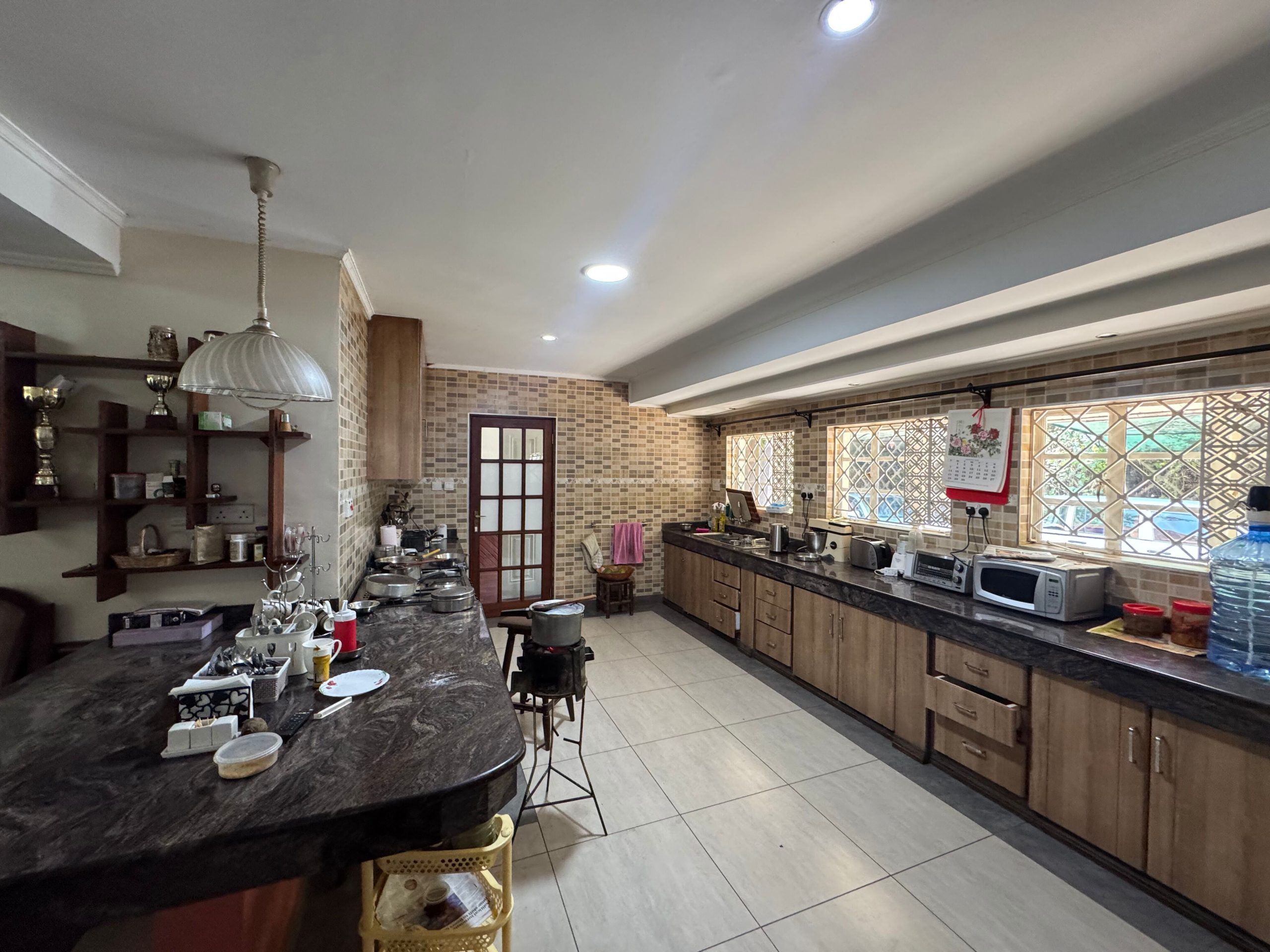 This charming house in Muthaiga exudes character and sits on an expansive, mature garden filled with lush greenery.