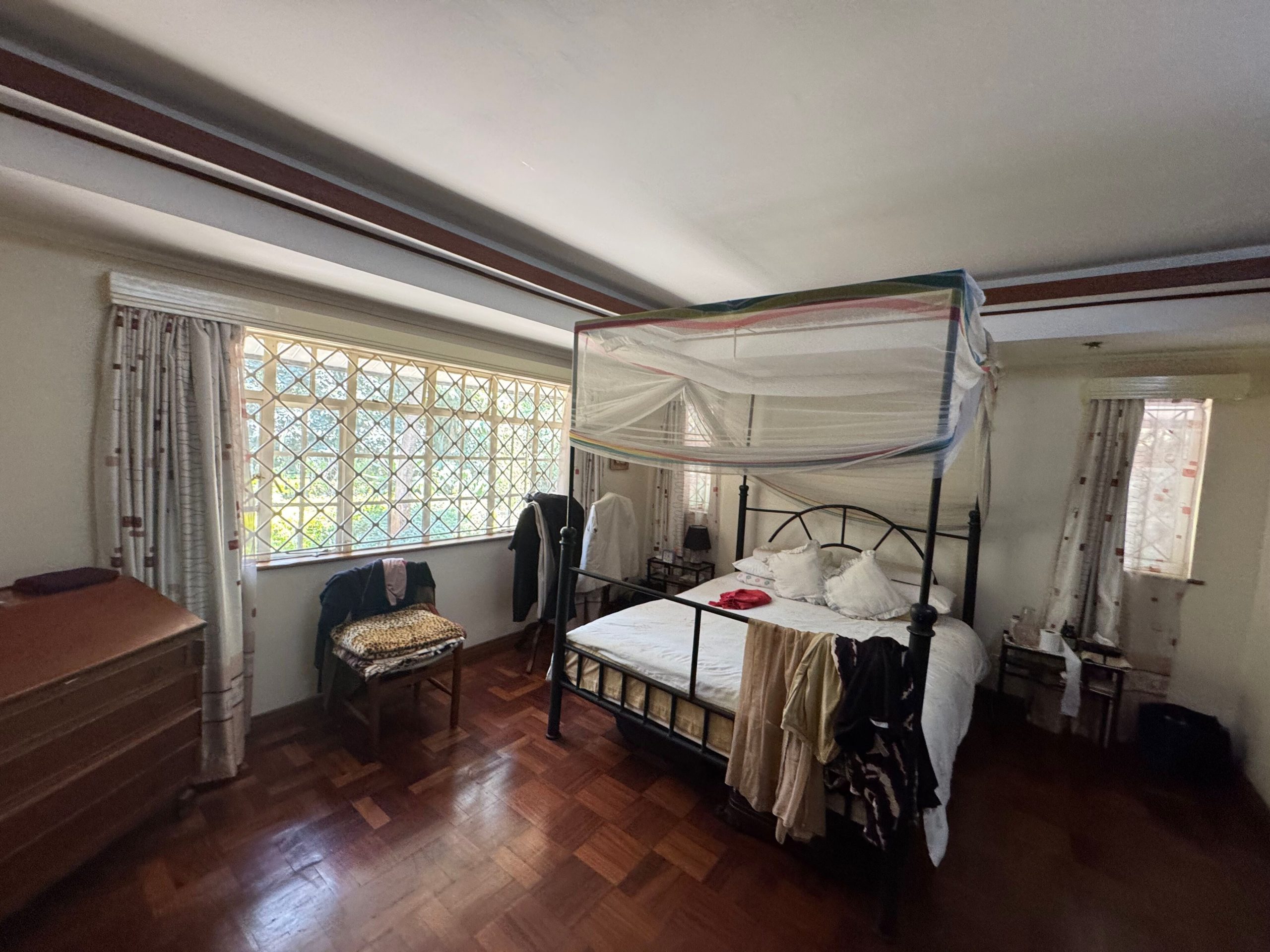 This charming house in Muthaiga exudes character and sits on an expansive, mature garden filled with lush greenery.