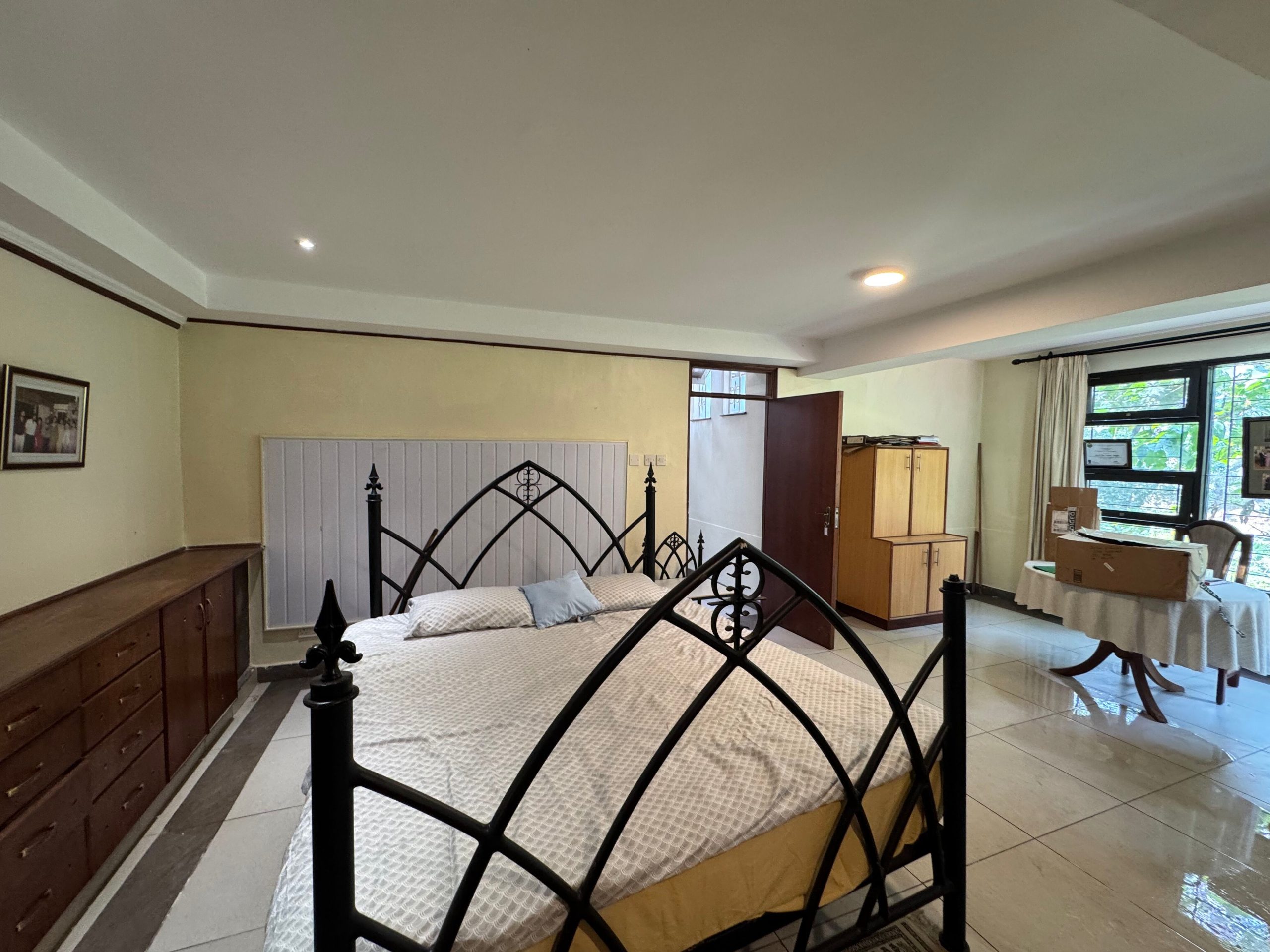 This charming house in Muthaiga exudes character and sits on an expansive, mature garden filled with lush greenery.